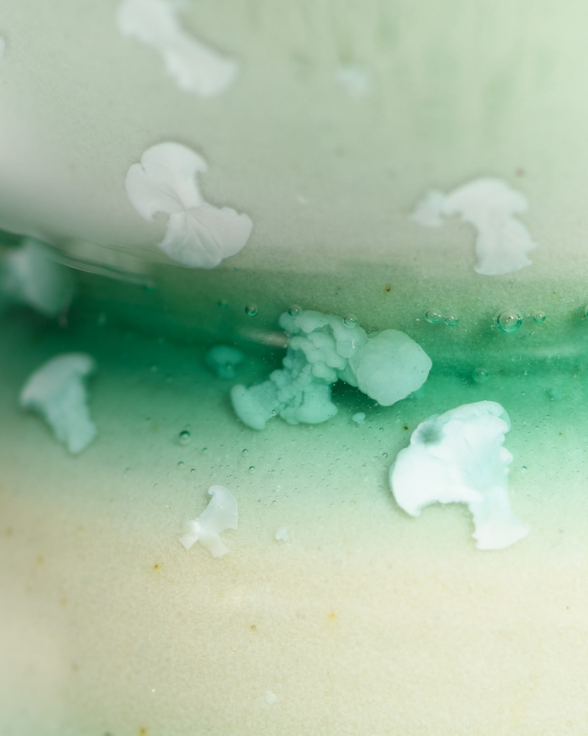 Close up of crystal in a piece glazed with Crystal Green