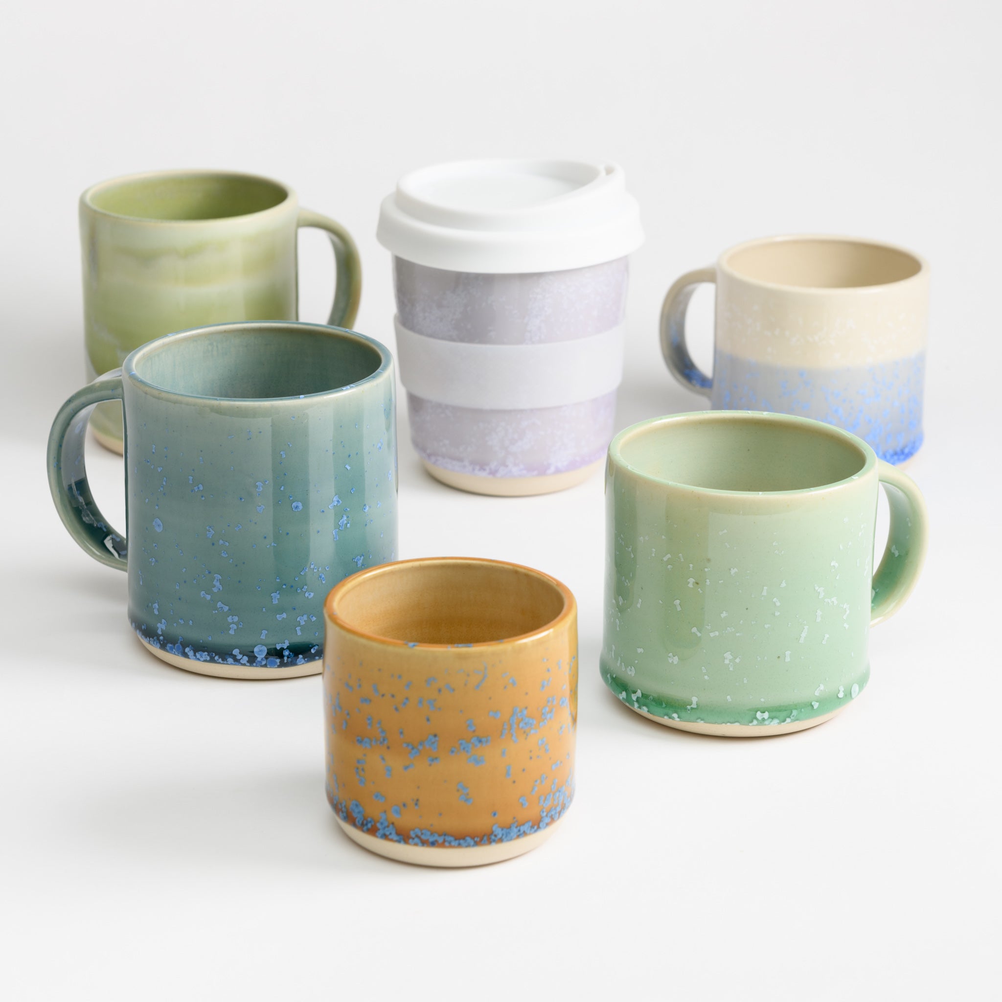 Pretty handmade ceramic mugs and cups in beautiful colours