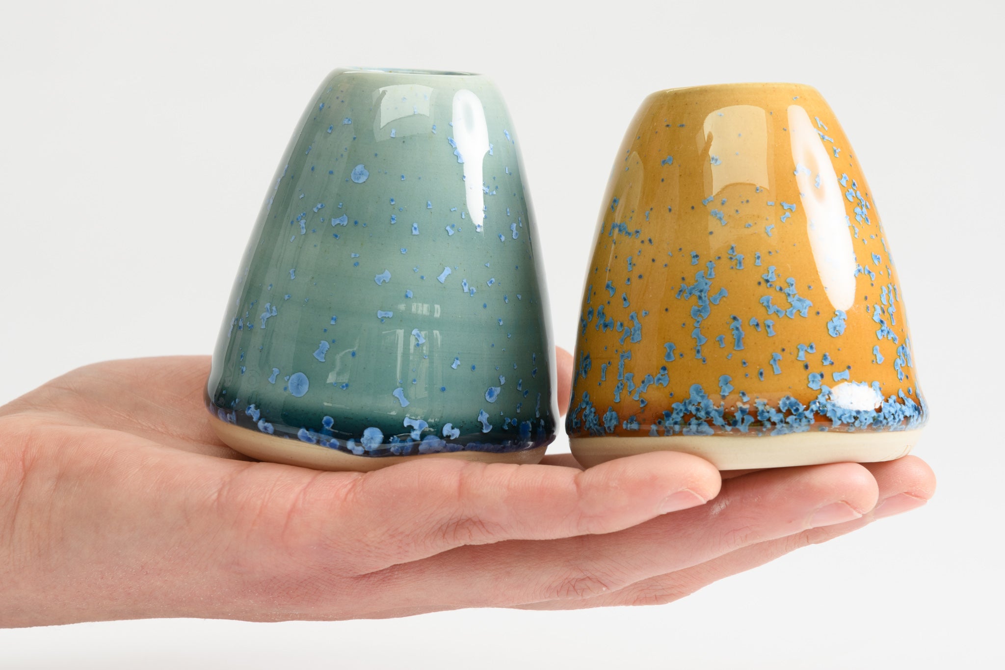 Pair of mini vases in teal and amber